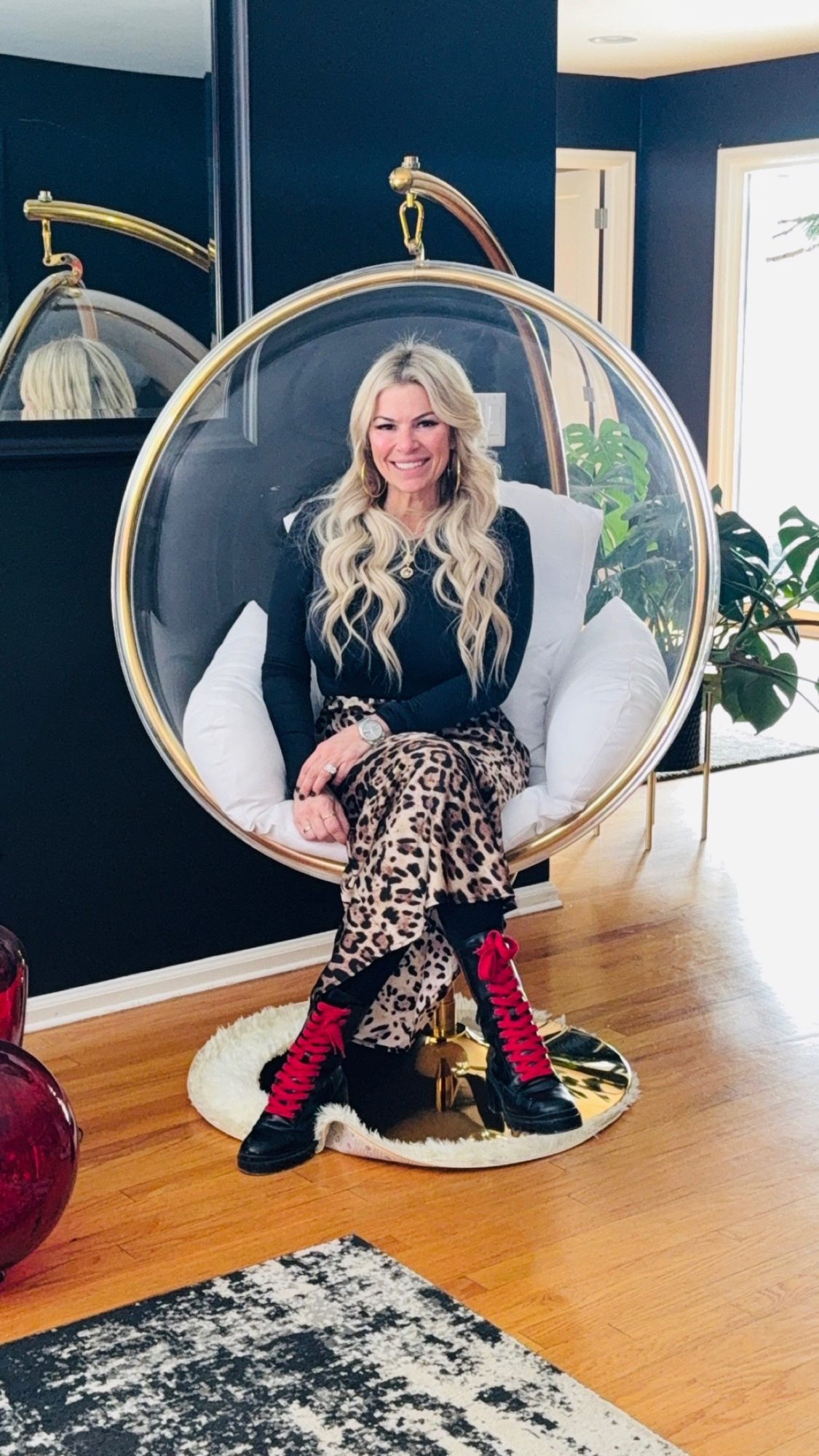 Dr. Christine in the hanging bubble chair