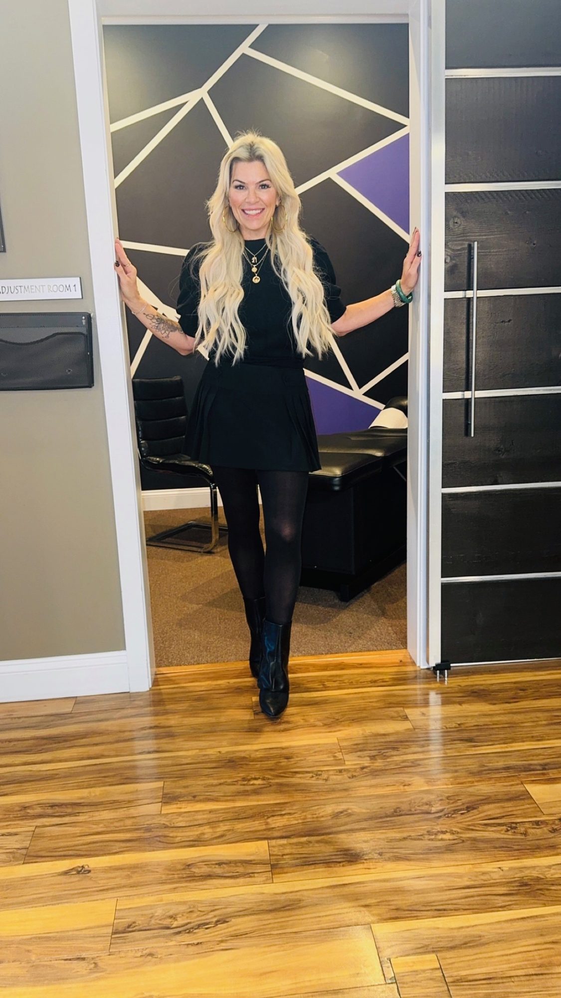 Dr. Christine in the doorway of the purple geometric room