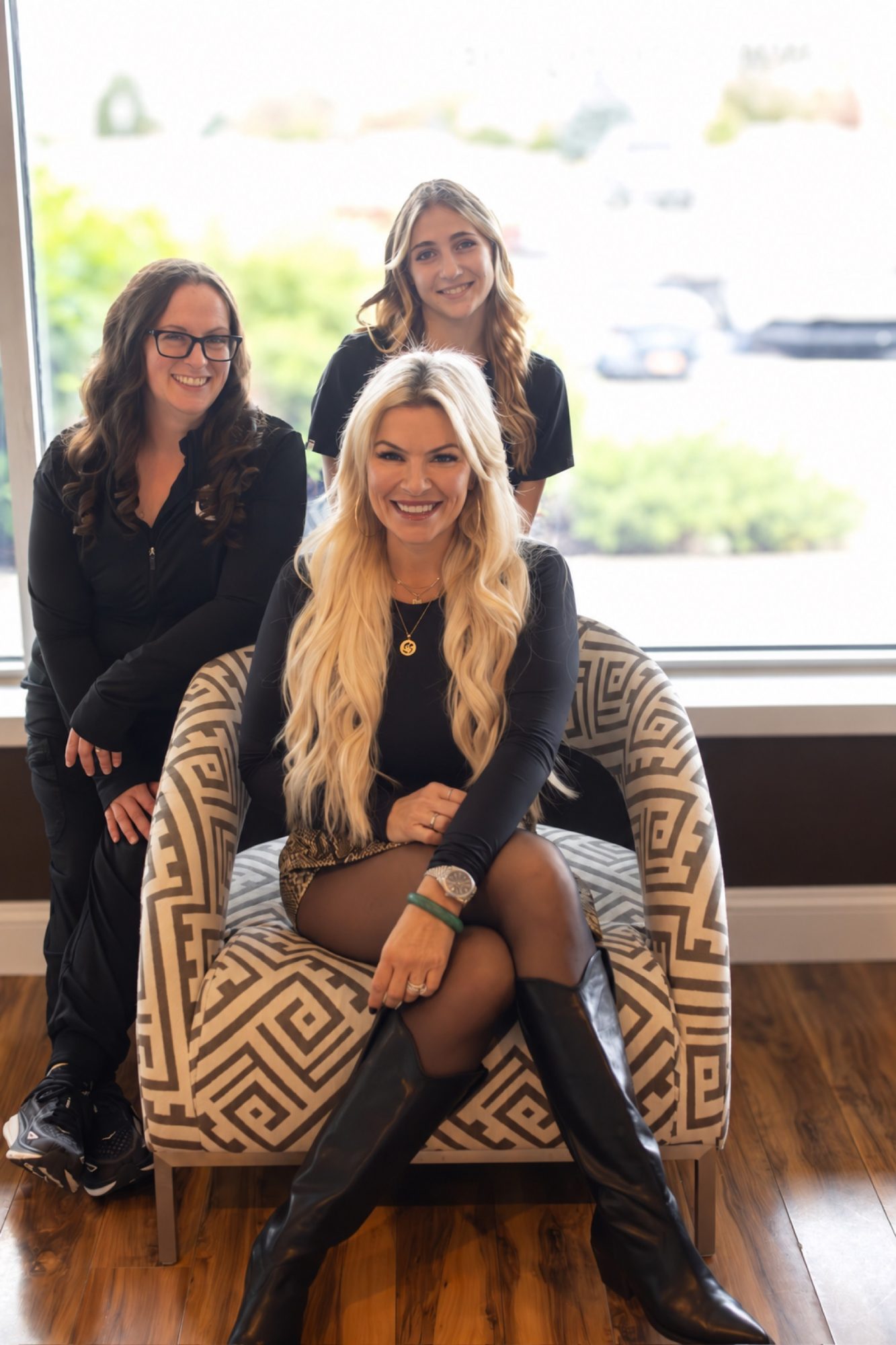 Three of the team by the front window